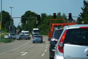 Car Stopped At Red Light On Road