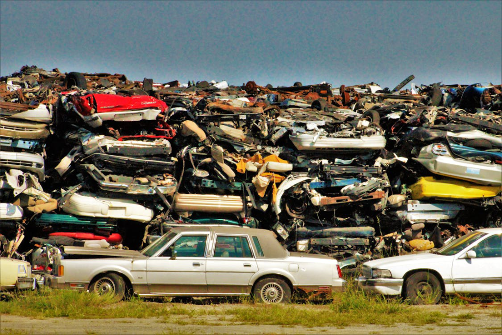 Junk cars stacked in a salvage yard