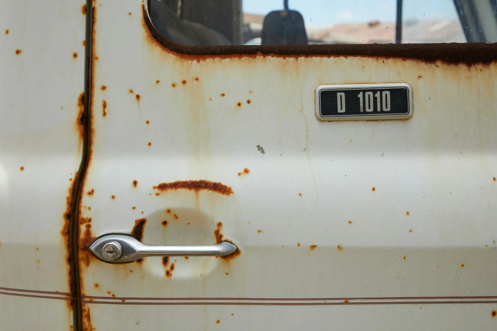 Old rusty door of a retro car