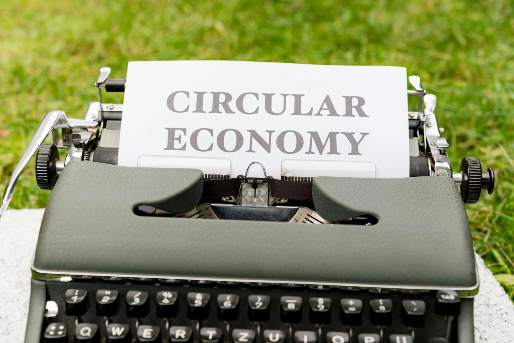 A typewriter with the word circular economy written on the paper