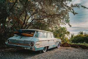 Old blue car parked