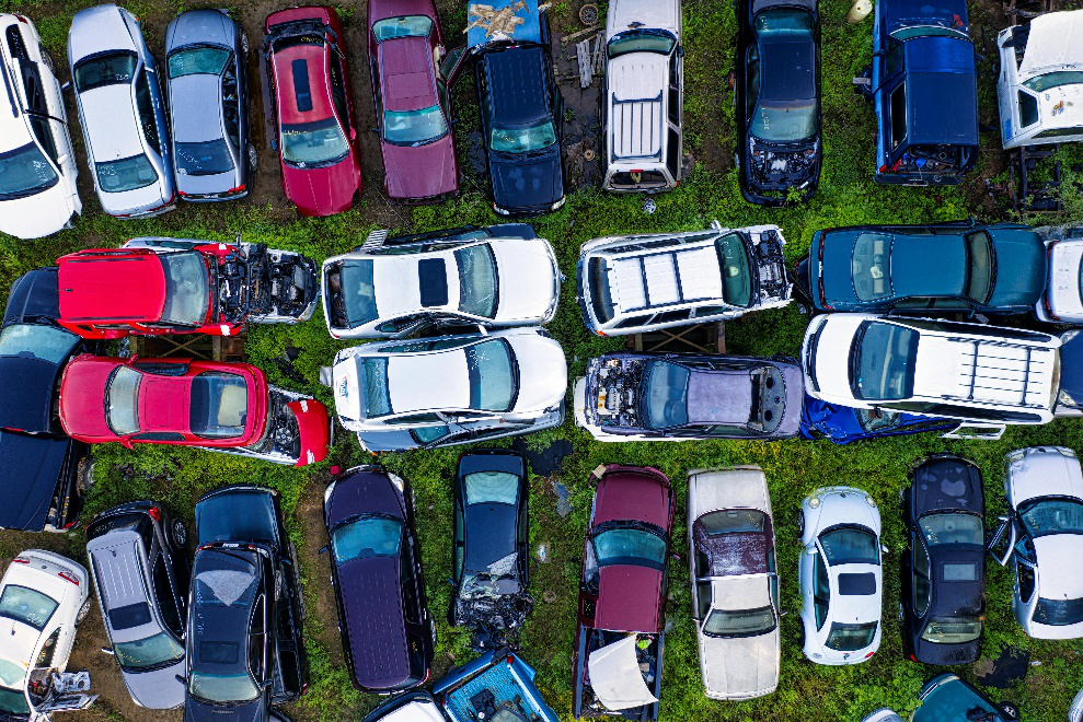 Salvage yard containing old cars 