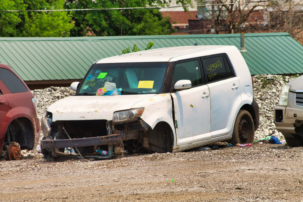 A junk car without tires.