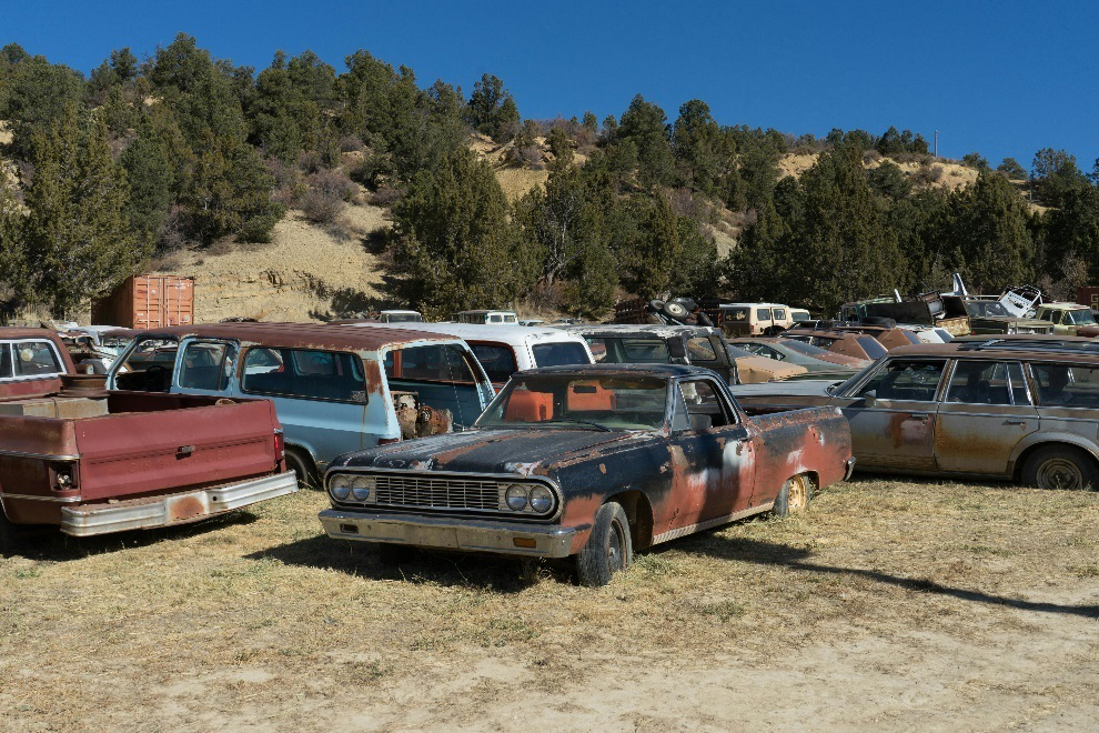 Old rusty cars in a junkyard