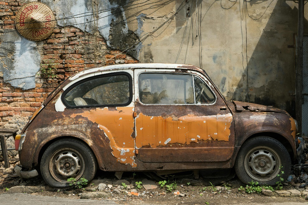 Close shot of a rusty, abandoned car