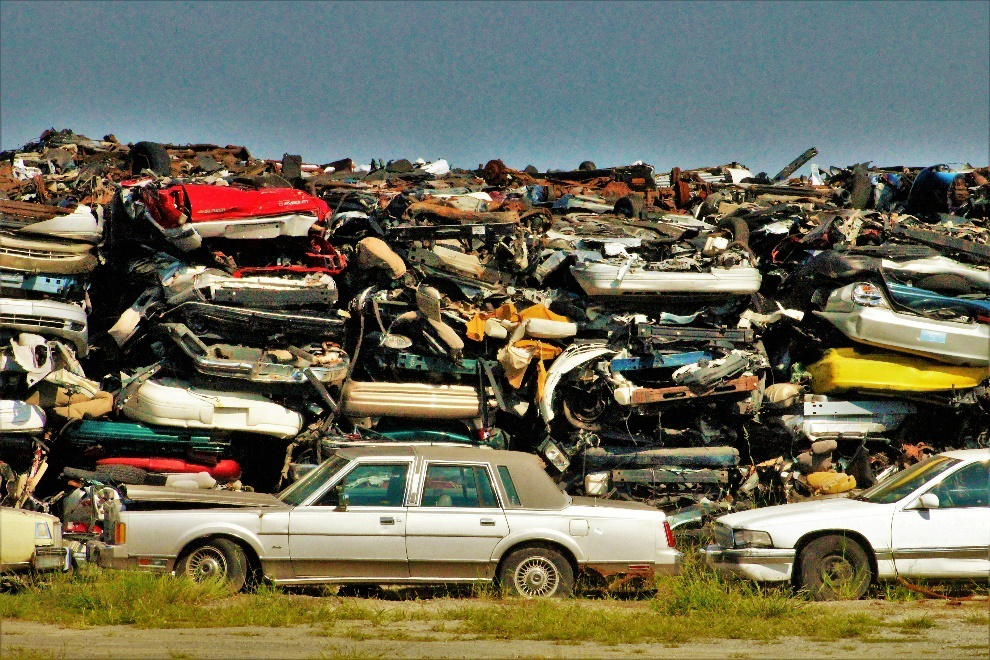 Hundreds of cars stacked atop each other in a salvage yard